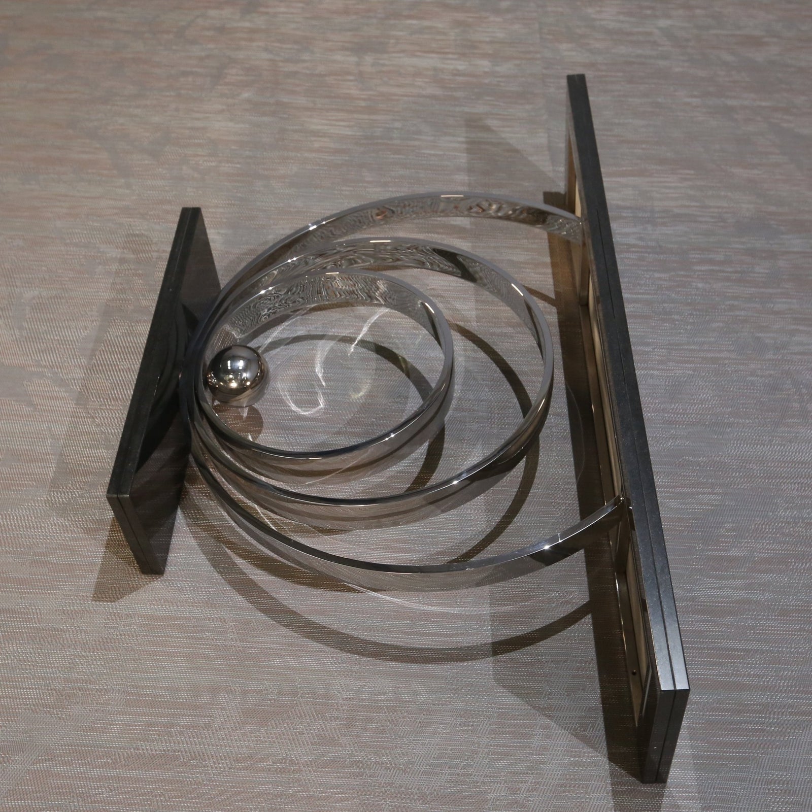 Decorus Ammonite Console Table in Polished Stainless Steel with Black Granite Top @ REHAUS