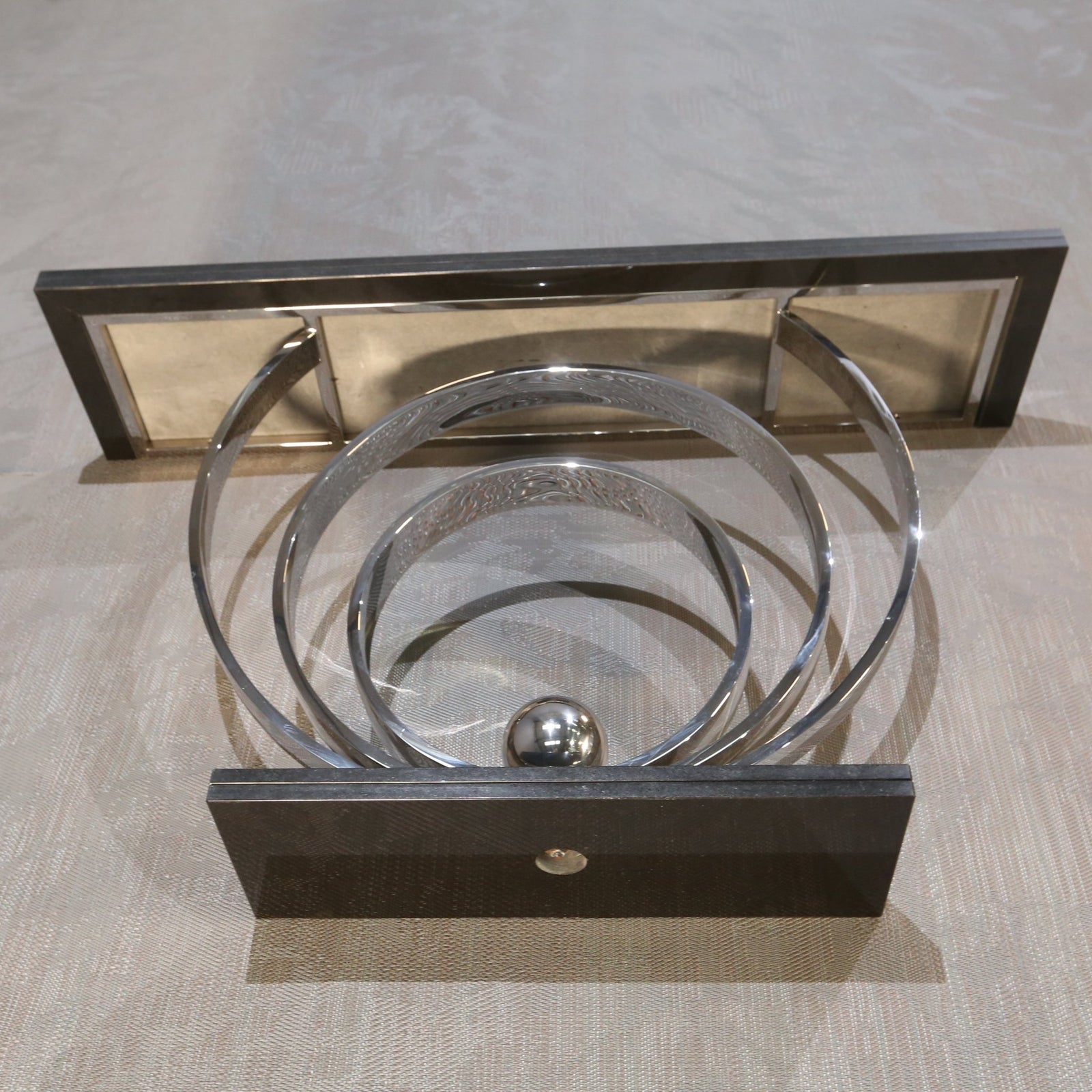 Decorus Ammonite Console Table in Polished Stainless Steel with Black Granite Top @ REHAUS