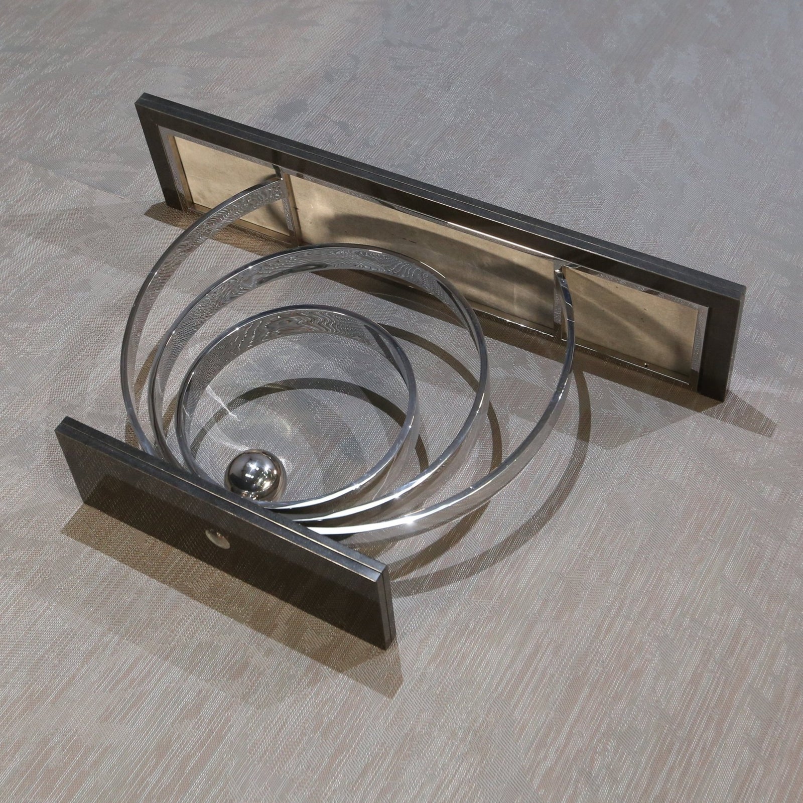 Decorus Ammonite Console Table in Polished Stainless Steel with Black Granite Top @ REHAUS