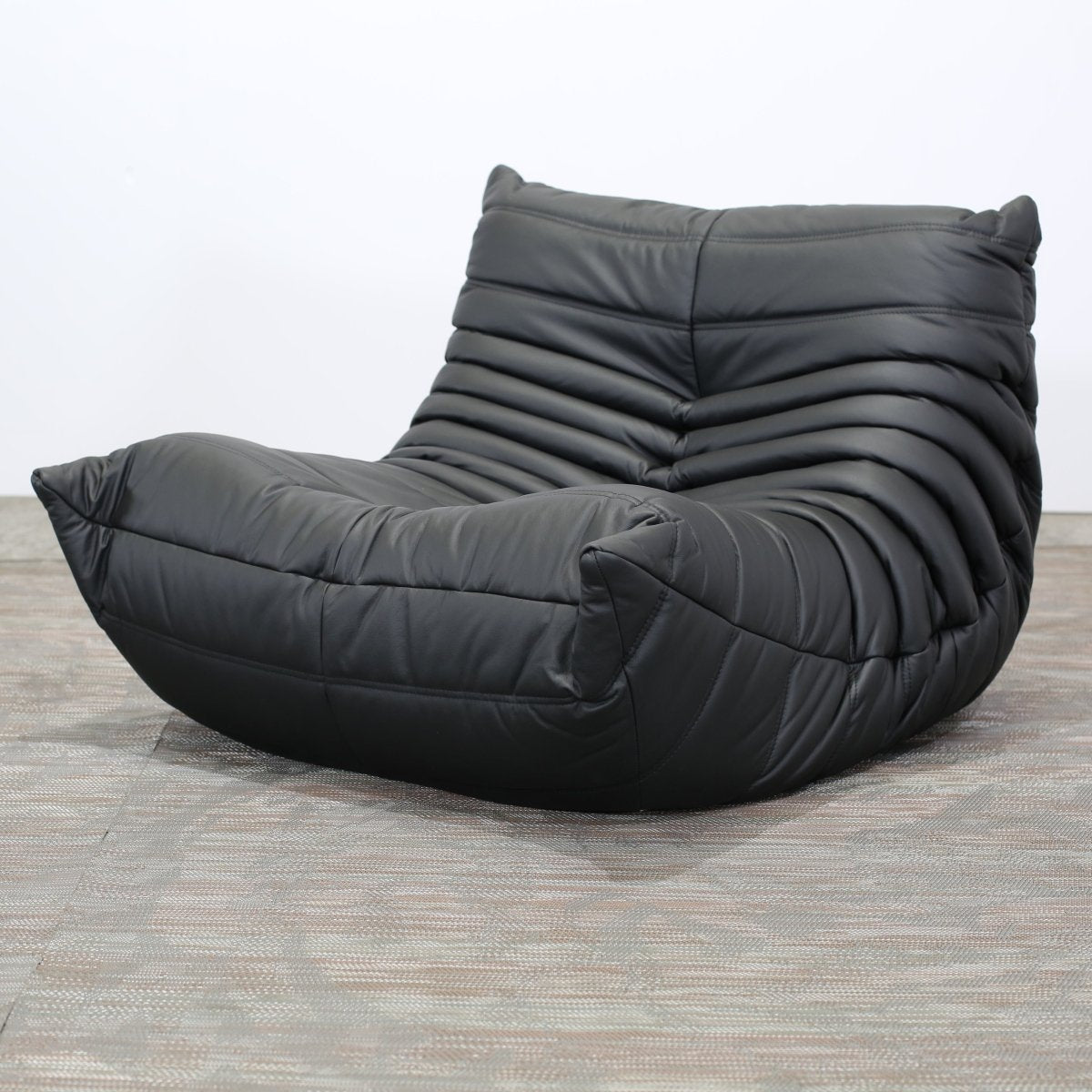 Ligne Roset Black Leather Togo Armchair and Footstool by Michel Ducaroy, Set of Two @ REHAUS