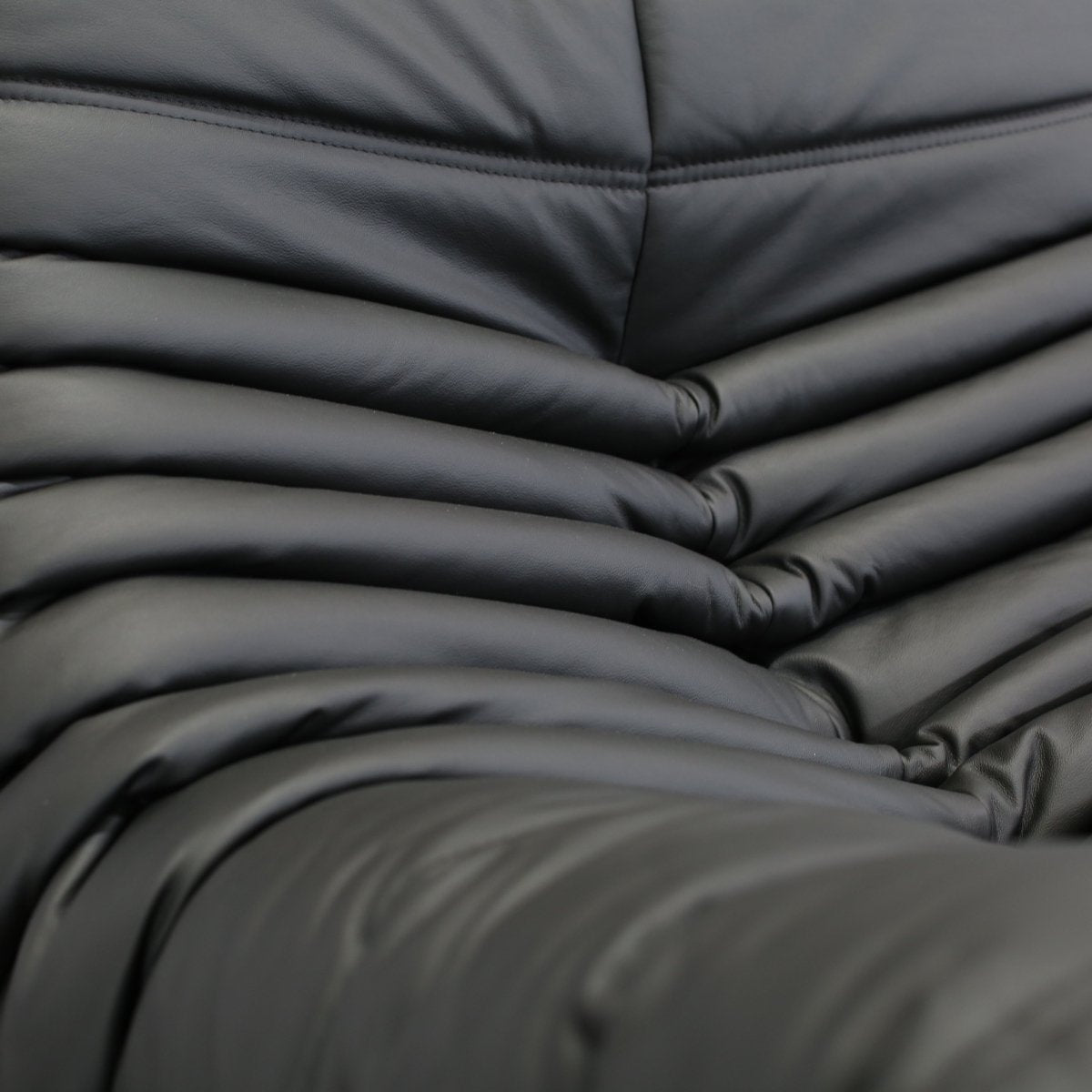Ligne Roset Black Leather Togo Armchair and Footstool by Michel Ducaroy, Set of Two @ REHAUS