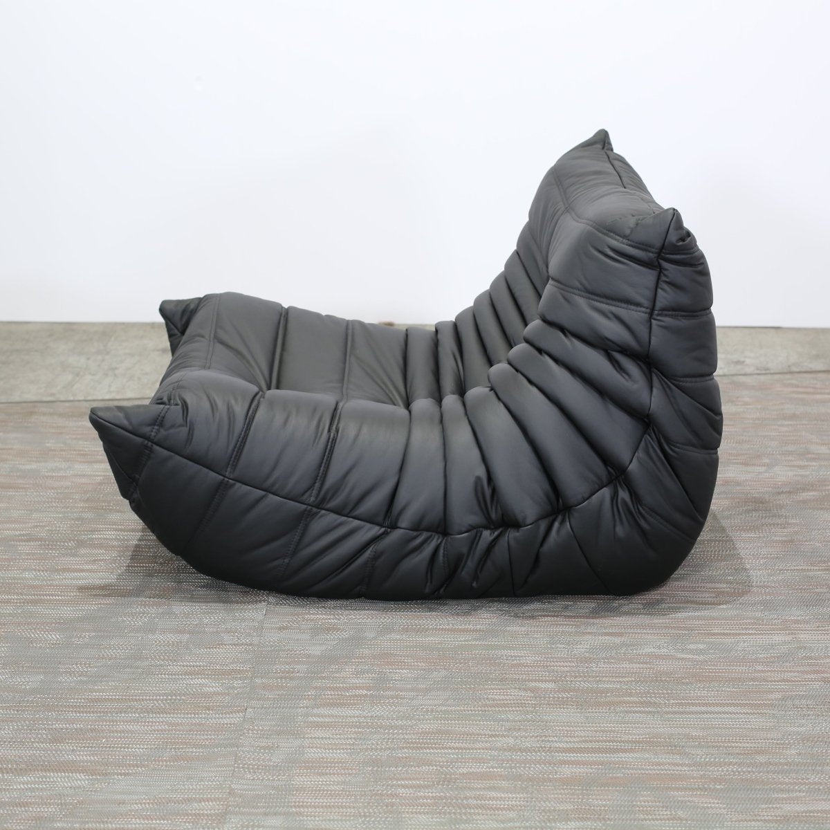 Ligne Roset Black Leather Togo Armchair and Footstool by Michel Ducaroy, Set of Two @ REHAUS