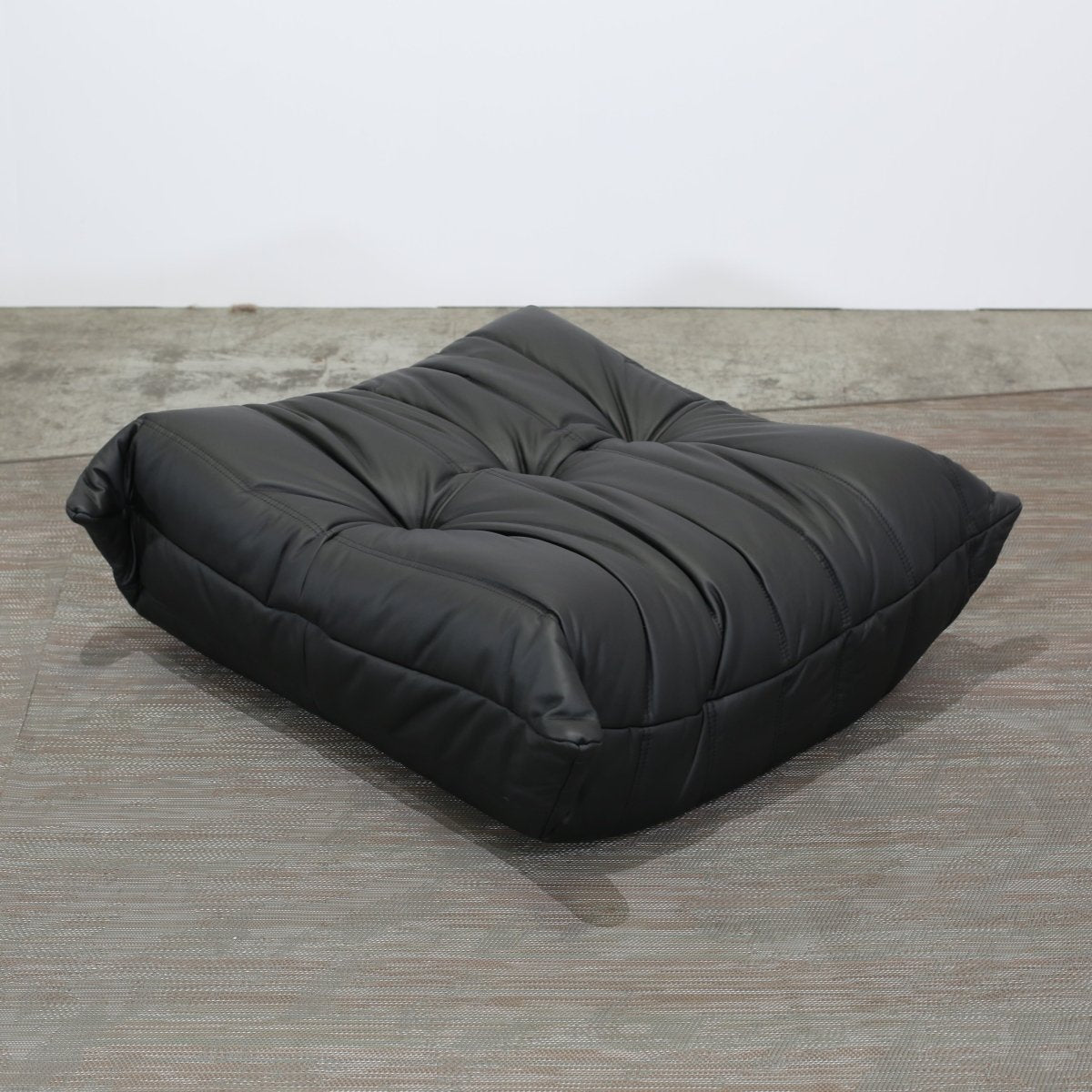 Ligne Roset Black Leather Togo Armchair and Footstool by Michel Ducaroy, Set of Two @ REHAUS