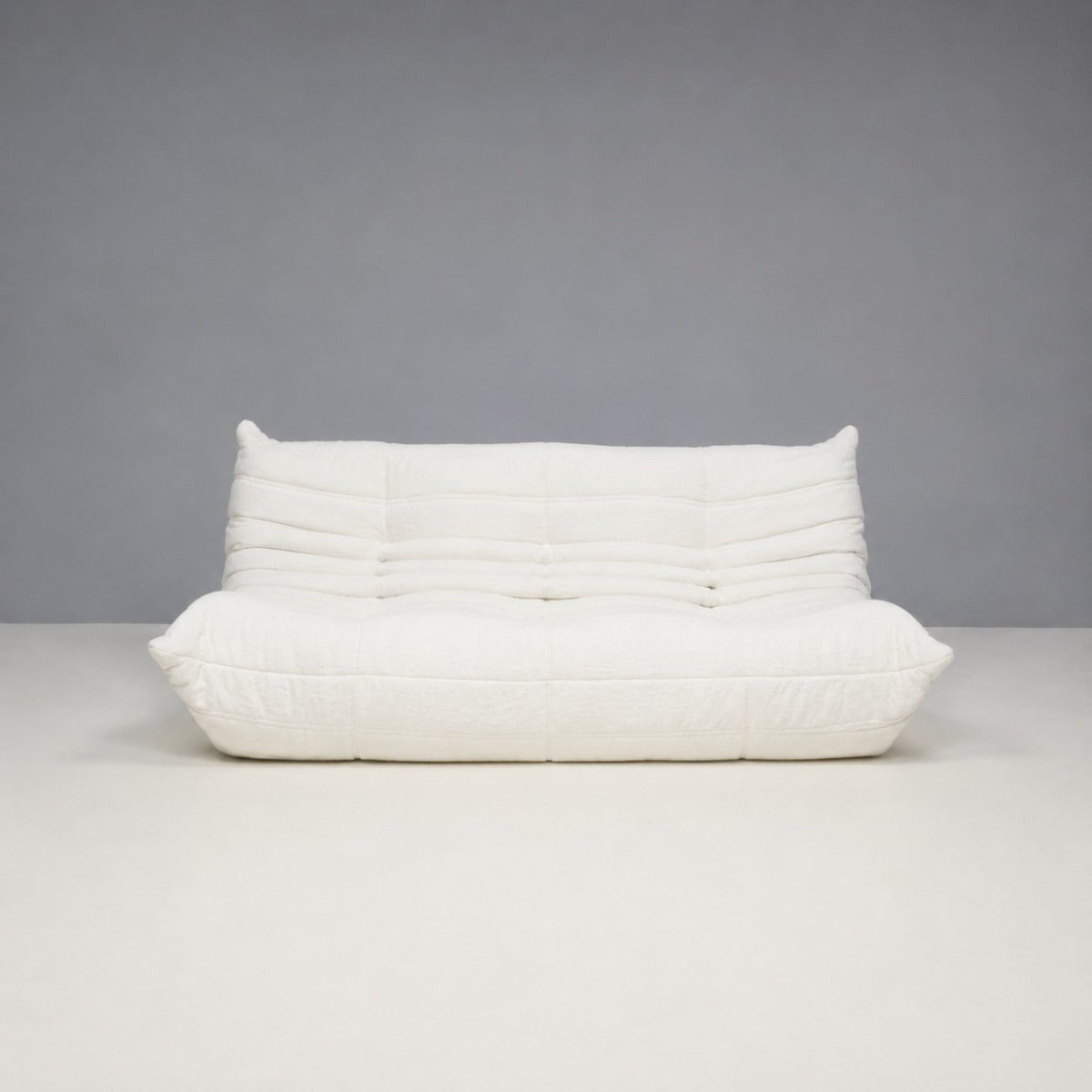 White Bouclé Togo Three Seater and Footstool, Set of Two @ REHAUS